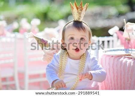 Little princess baby girl celebrate her birthday party outdoor