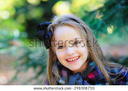 Happy cute girl in autumn fall outdoor