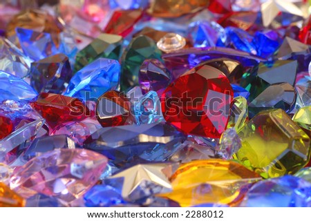 Big pile of colorful, differently cut gems