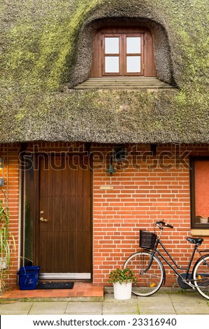 Fragment of traditional european house with straw roof