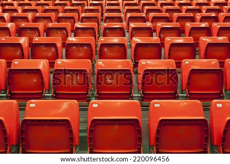 Empty stadium red seats before a match