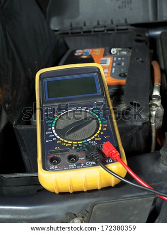 Multimeter set up and ready for taking car battery voltage measurement