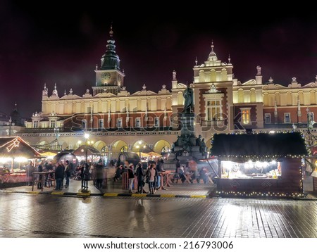 KRAKOW, POLAND - DECEMBER 19 2013: Annual christmas fair with seasonal stands organized during christmas time on the Main Market Square in Krakow, Poland