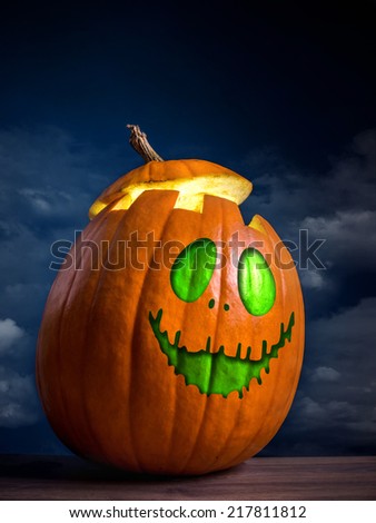 Jack-o-lantern pumpkin shot against dark blue sky