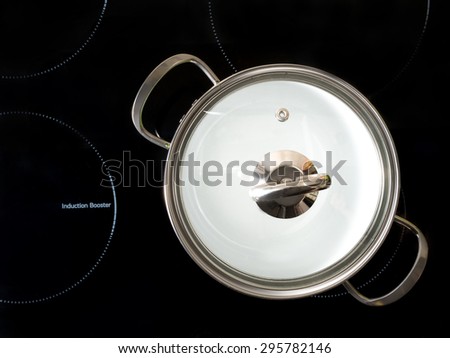 Stewpot on black induction cooker shot from above