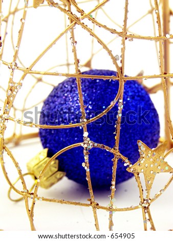 Christmas ball in golden cage