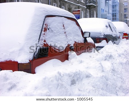 stock photo Row of cars stuck in heavy snowbank