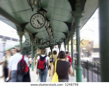 Commuters in railway station passage with zoom effect
