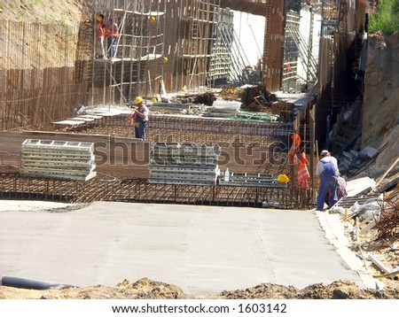 Construction workers working with underground tunnel structure