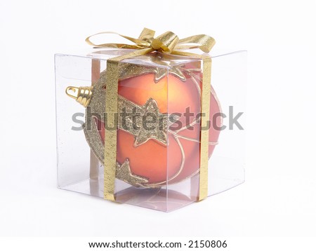 Christmas ball packed in transparent box over white background