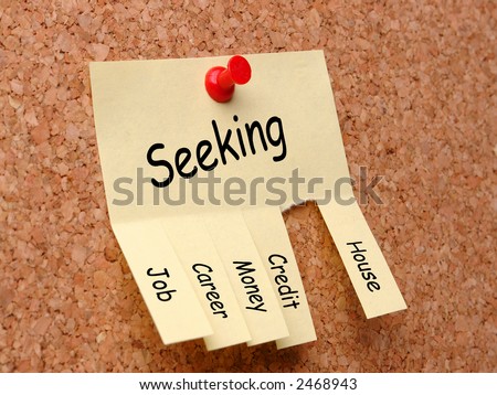 Yellow post-it note with job, career, money, credit, house seeking ad, affixed to the corkboard with red pushpin