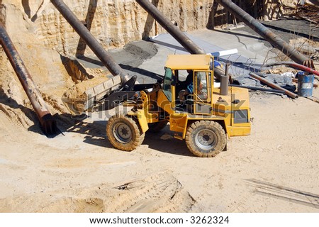 Front-end loader working in giant excavation