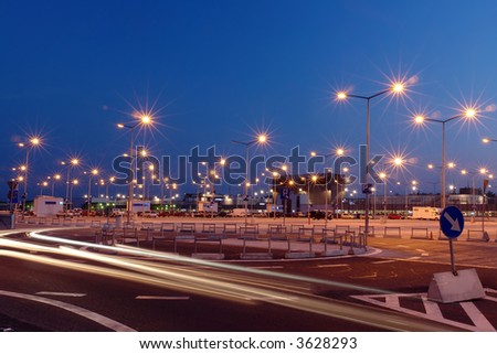 Lanterns at shopping mall parking lot illuminated at night