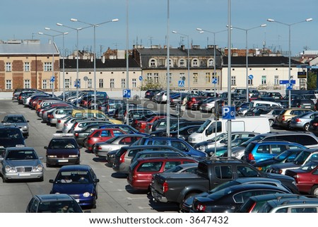Aerial view of shopping center car crowded parking lot