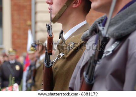 Closeup of soldiers performing duty of honor guard by Tomb of Unknown Soldier on Independence Day of Poland - Krakow