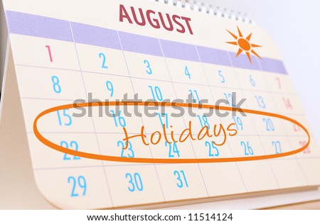 Desktop calendar showing August month with highlighted planned summer holidays