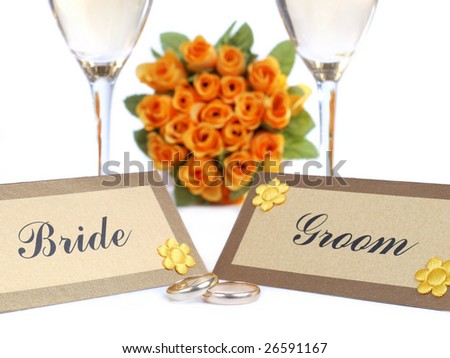 stock photo Table with Bride and Groom name cards wedding rings 