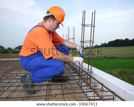 Bar bender fixing steel reinforcement for house concrete floor slab