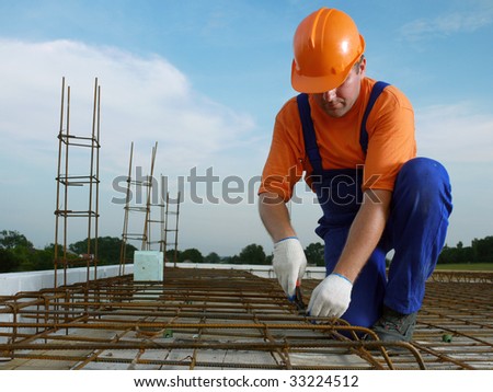 Bar bender fixing steel reinforcement for house concrete floor slab