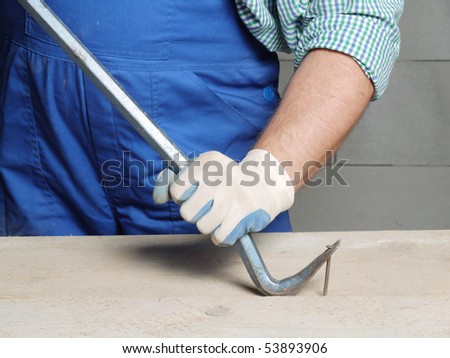 stock-photo-worker-pulling-a-nail-from-a-plank-using-wrecking-bar-53893906.jpg