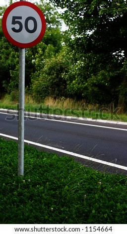 Caution road sign. The speed limit on this road is 50 miles per hour Northumberland UK