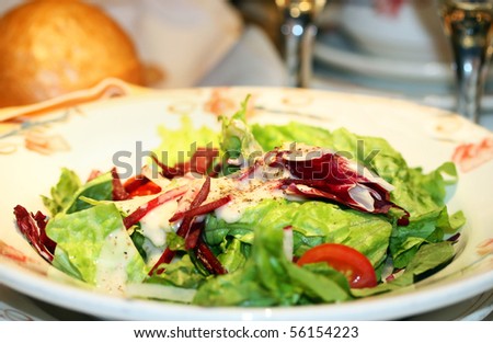 Fresh green salad appetizer in the restaurant