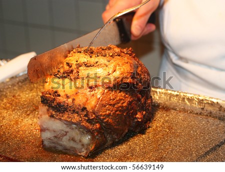 Cutting hot prime rib at the banquet