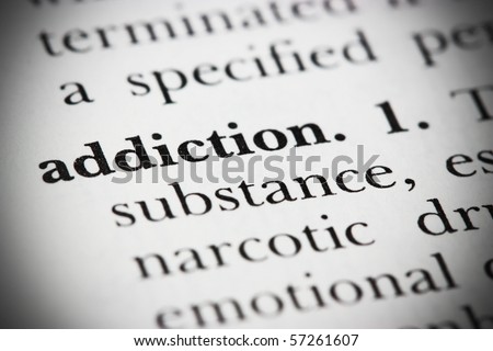 Close up of a dictionary word Addiction
