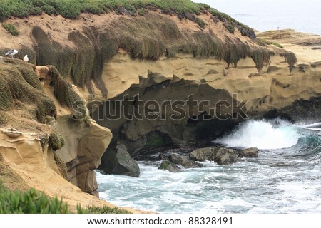 Ocean waves under the cliff