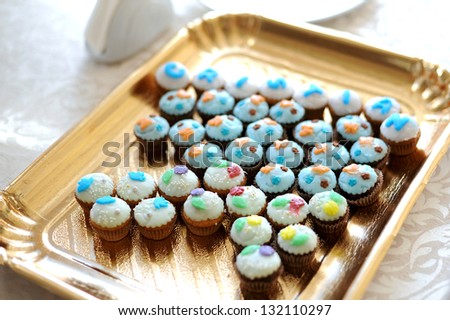 decorated chocolate muffins on tray