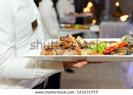 tray with grilled meat and vegetables