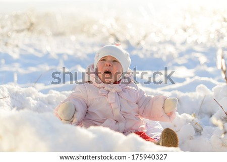scared little girl crying in snow