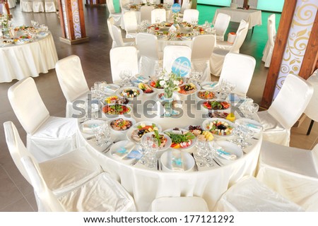 decorated round table with food at restaurant