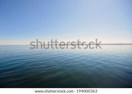 scenery of lake and horizon line on mountains