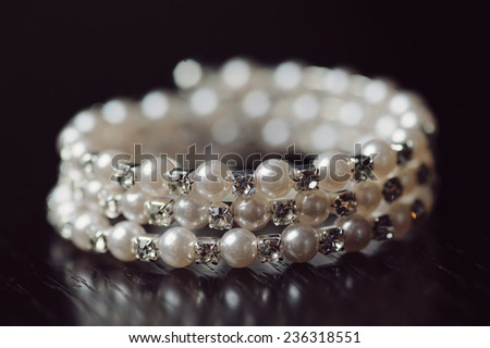 closeup of pearl bracelet with crystals