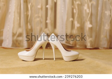 white shoes with high heels on floor