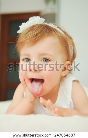 funny girl showing long tongue