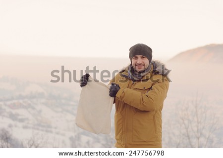 man holding empty textile bag