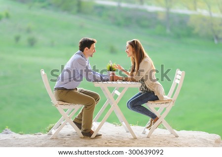 happy couple talking at table