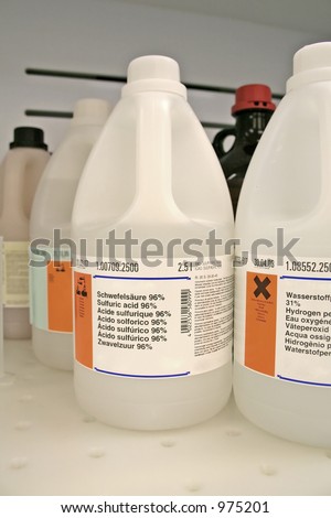Chemical bottles on wet bench in the lab