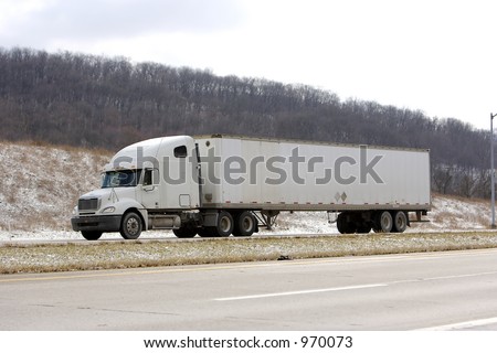 White Tractor Trailer With White Blank Trailer on Highway