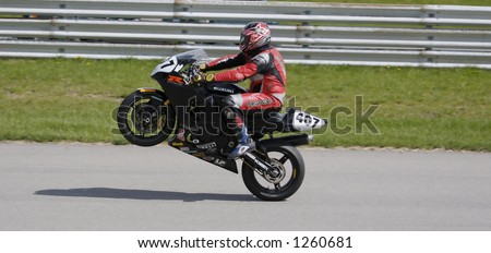 Sport Bike Pulling a Wheelie after powering out of turn
