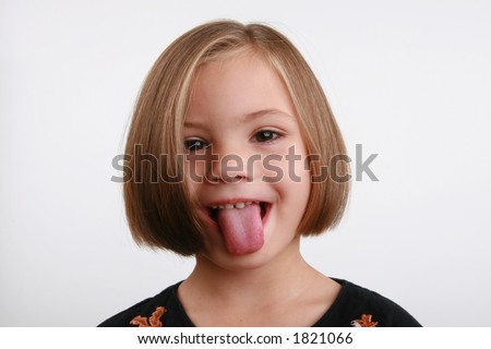 five year old girl sticking her tongue out