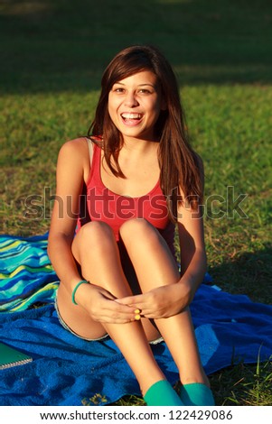 Beautiful multicultural young college woman enjoying outdoor campus life.