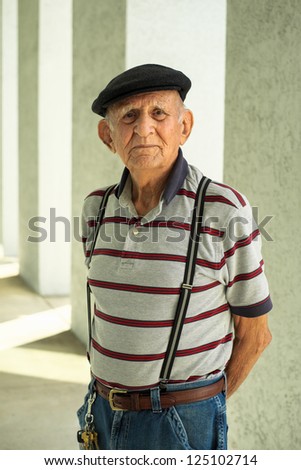 Elderly 80 plus year old man portrait in a outdoor setting.