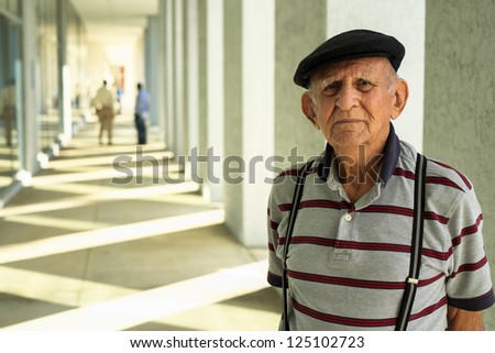 Elderly 80 plus year old man portrait in a outdoor setting.