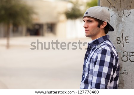 Handsome young man outdoors in a downtown urban setting.