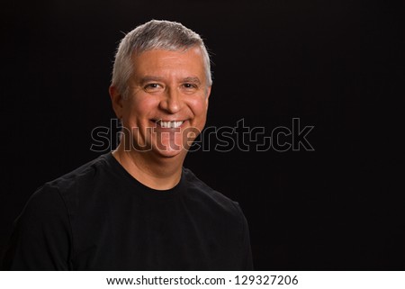 Handsome middle age man in a studio portrait.
