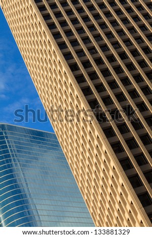 Close up view of a pair of downtown skyscrapers.