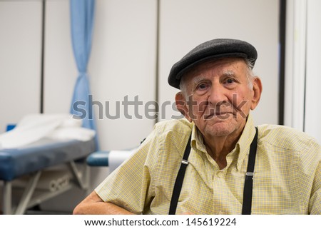 Elderly 80 plus year old man receiving physical therapy.